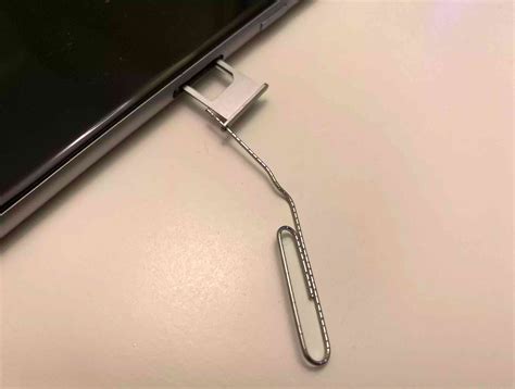 can't open sim card tray iphone